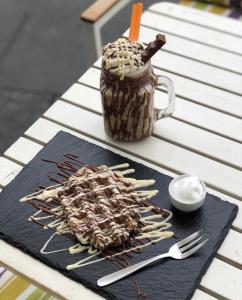 a table with a jar and utensils on a table at Citykey Napoli - Bed & Breakfast in Naples