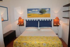 Кровать или кровати в номере Appartamento La Perla a soli 100m dal mare a Marina di Castagneto