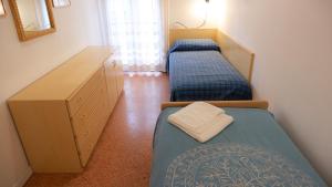 Postel nebo postele na pokoji v ubytování App4rent Saturno 4 - family apartment, wifi, parking