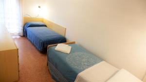 Postel nebo postele na pokoji v ubytování App4rent Saturno 4 - family apartment, wifi, parking
