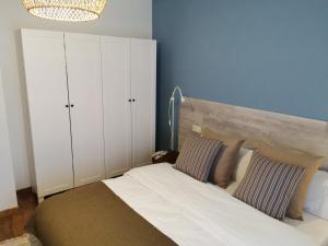 a bedroom with a bed with two pillows at Privilege La Bonaigua in Esterri d'Àneu