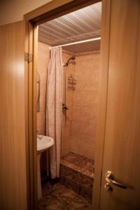 a bathroom with a shower and a sink at MKM Hotel in Moscow
