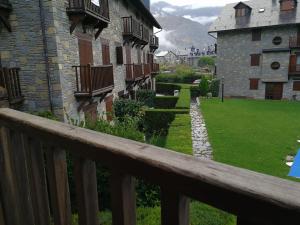 a view from a wooden balcony of a building at Privilege La Bonaigua in Esterri d'Àneu