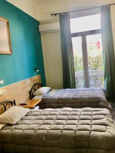 
Ein Bett oder Betten in einem Zimmer der Unterkunft Hotel Kastoria
