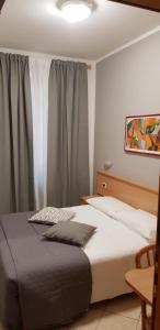 Posteľ alebo postele v izbe v ubytovaní Hotel Astor