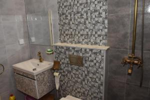 a bathroom with a toilet and a sink and a shower at Arabesque Style - 2 appartements in Kelibia +37 photos
