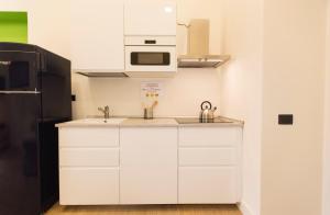 Kuchyňa alebo kuchynka v ubytovaní N A P Experience Apartments