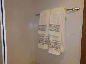 a bathroom with towels hanging on a towel rack at Studio Villa Park 207 in Borovets