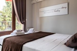 a bedroom with a bed with towels on it at Villa Azur Cap d'Ail in Cap d'Ail