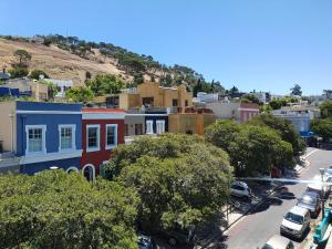 an aerial view of a city with houses and cars at De Waterkant Cottages in Cape Town