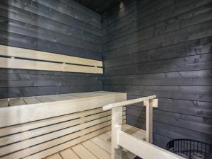 a sauna with wood paneling and a staircase at Holiday Home Kasnäs marina c 22 by Interhome in Kasnäs