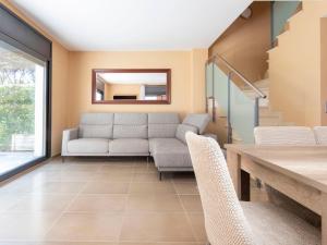 a living room with a couch and a table at Holiday Home Sol Cambrils Park-6 by Interhome in Cambrils