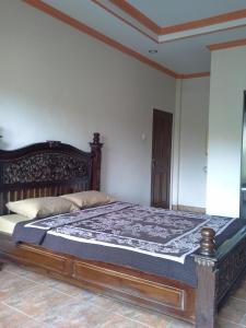 Katil atau katil-katil dalam bilik di Pica Sedana Homestay