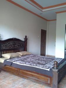 Кровать или кровати в номере Pica Sedana Homestay +15 фотографий