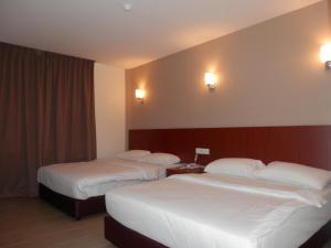Кровать или кровати в номере LKS Hotel