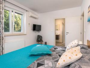 Postel nebo postele na pokoji v ubytování Holiday Home Casetta Filip by Interhome