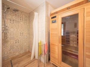 a bathroom with a shower and a glass door at Holiday Home Luna by Interhome in Brseč