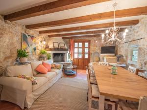 a living room with a table and a dining room at Holiday Home Luna by Interhome in Brseč