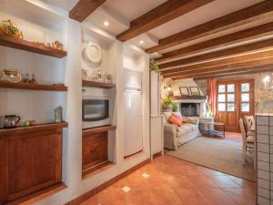 a kitchen and living room with wooden beams at Holiday Home Luna by Interhome in Brseč