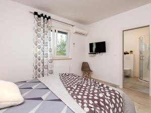 Postel nebo postele na pokoji v ubytování Holiday Home Casetta Filip by Interhome