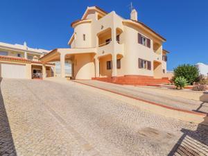 a large house on a cobblestone street at Villa Flor de Maio by Interhome in Patroves