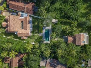 an overhead view of a house with palm trees at Kiri Palu in Ahangama