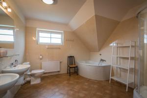a bathroom with a sink toilet and a bath tub at Villapark Vlašky in Bešeňová +46 photos