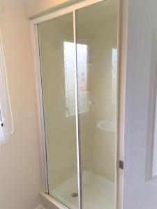 a glass shower stall in a bathroom at Revamped & Upgraded 6 Berth Static Caravan on Southview Skegness in Skegness