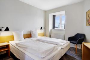 Postelja oz. postelje v sobi nastanitve Hotel Garni