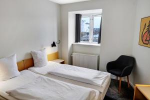 Postelja oz. postelje v sobi nastanitve Hotel Garni