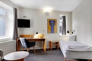 TV in/ali zabaviščno središče v nastanitvi Hotel Garni