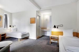 Postelja oz. postelje v sobi nastanitve Hotel Garni