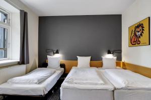 Postelja oz. postelje v sobi nastanitve Hotel Garni