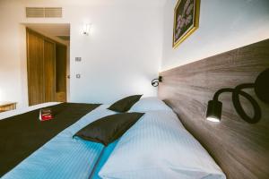 a bedroom with two beds in a room at Pansion Bernarda Nova in Varaždinske Toplice