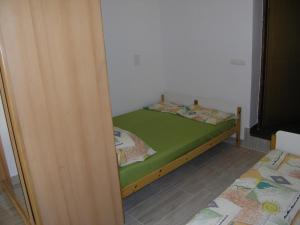 Postel nebo postele na pokoji v ubytování Apartments Jelekovac
