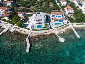 an aerial view of a house in the water at Villa Soleil in Vela Luka