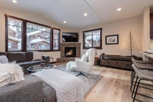 a living room with a couch and a fireplace at Mountainside 15 in Mammoth Lakes