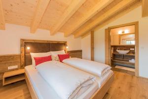 Tempat tidur dalam kamar di Hinterjetzbachhof