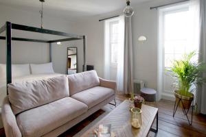 a living room with a couch and a bed at Spirit of Prince Street Hull Old Town in Hull