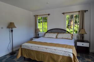 Postel nebo postele na pokoji v ubytování Sugarmon Villas