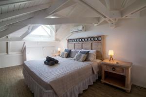 Ένα ή περισσότερα κρεβάτια σε δωμάτιο στο Résidence La Plage Orient Bay by La Conciergerie FWI