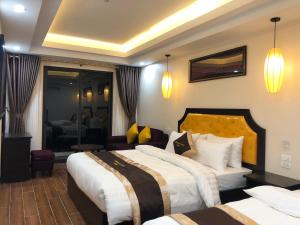 Postel nebo postele na pokoji v ubytování Muong Hoa View Hotel