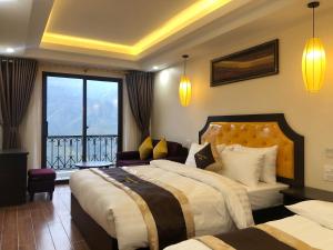 Postel nebo postele na pokoji v ubytování Muong Hoa View Hotel