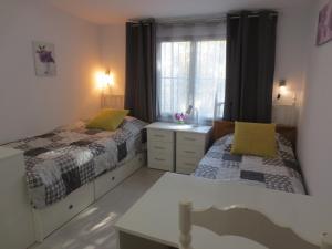 Łóżko lub łóżka w pokoju w obiekcie Clubrent - Townhouse La Merced