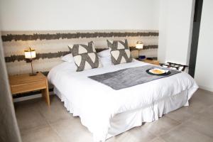 Ένα ή περισσότερα κρεβάτια σε δωμάτιο στο O2 Hotel Iguazu