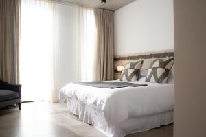 Ένα ή περισσότερα κρεβάτια σε δωμάτιο στο O2 Hotel Iguazu