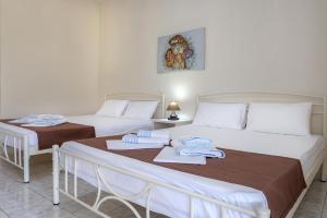 Letto o letti in una camera di Demi Studios