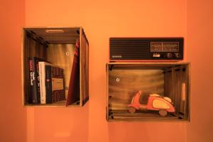 a box with a radio and a toy car in it at Residenza dei Pini in Civitanova Marche