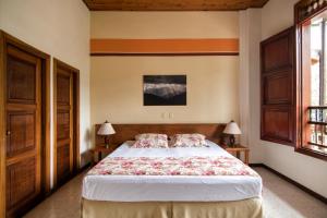 Postel nebo postele na pokoji v ubytování Hotel Valdivia Plaza