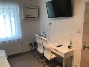 TV a/nebo společenská místnost v ubytování Hotel Michael